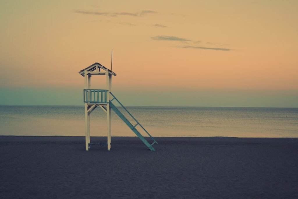Photo Image: Beach scene Nouns: Waves, surfers, beach, ocean, wetsuits, boards